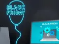 Neonowy balon z napisem "Black Friday" i laptopem. Dowiedz się, jak bezpiecznie kupować w internecie podczas wyprzedaży.