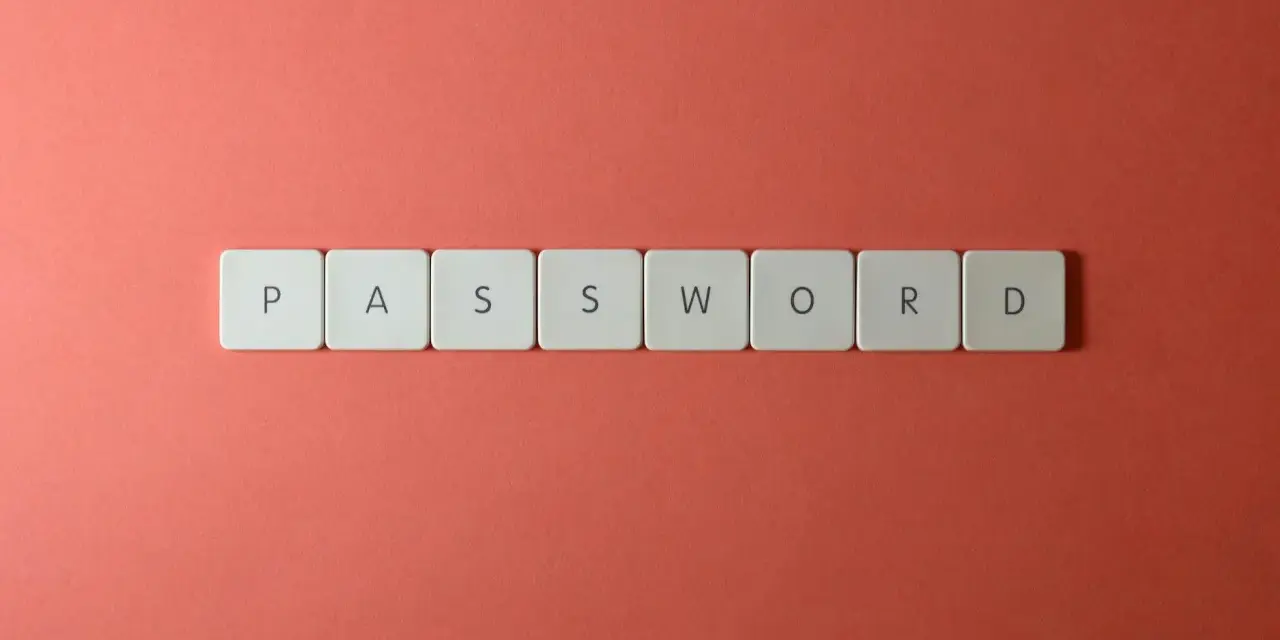 Litery układają się w słowo "PASSWORD". Dobry menedżer haseł to klucz do bezpieczeństwa.