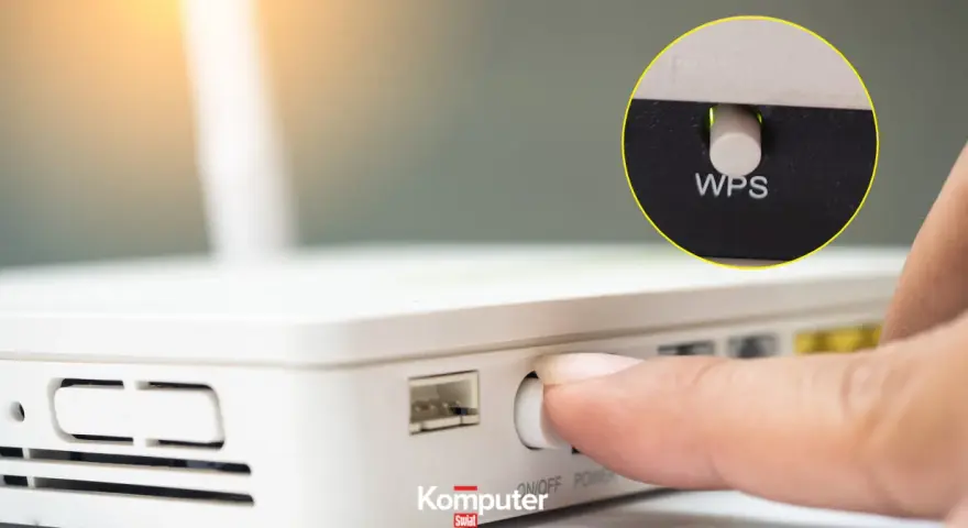 Palec naciska przycisk WPS na routerze, ułatwiając połączenie z siecią Wi-Fi.
