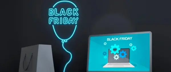 Neonowy balon z napisem "Black Friday" i laptopem. Dowiedz się, jak bezpiecznie kupować w internecie podczas wyprzedaży.